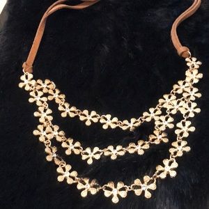 Gold toned 3 tiered flower necklace w leather
